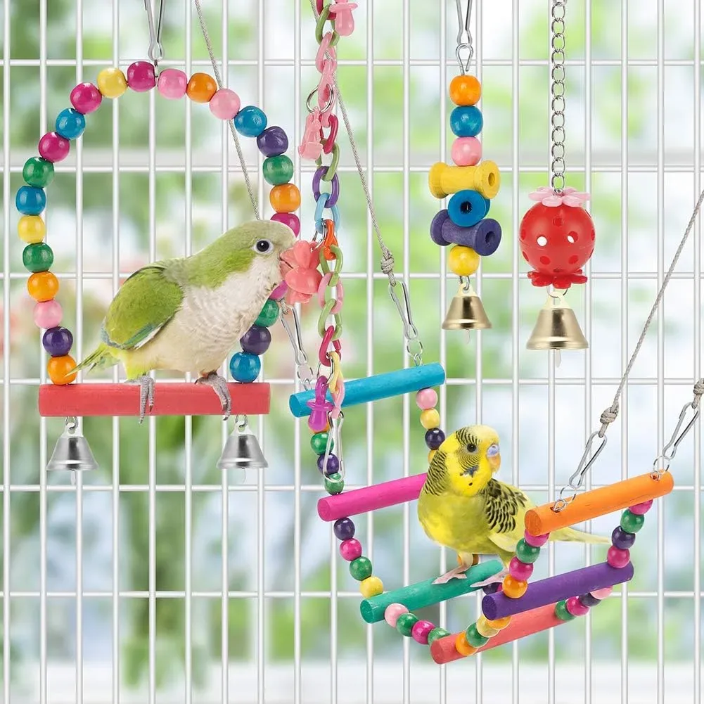 Parakeet toys hung from the top of a bird cage with hooks