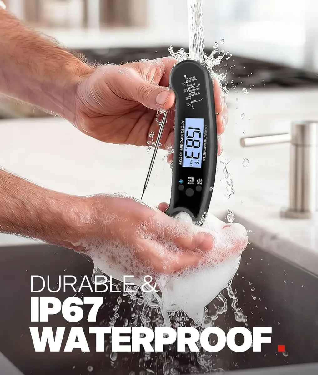 Instant read meat thermometer being rinsed under a running tap