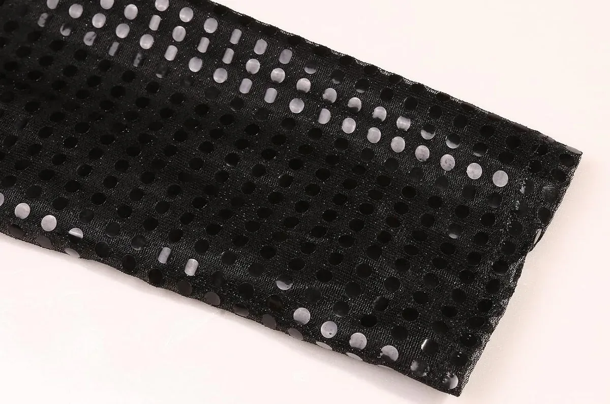 Densely stitched sleeve of the kids 80s pop star costume