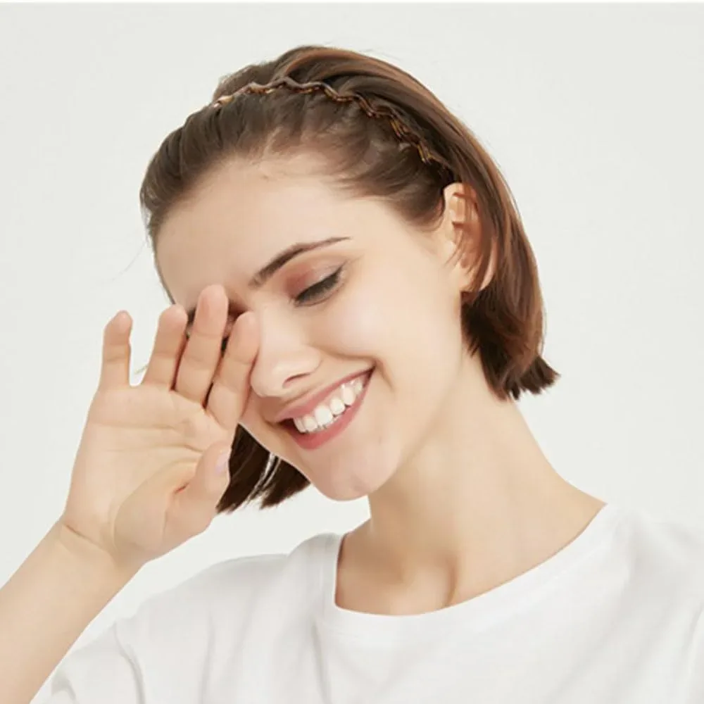 Woman with hair held back by a skinny teeth comb headband