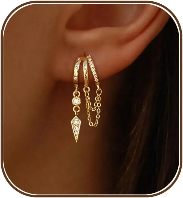 Detail of the hinged hoops on gold dangle huggie earrings