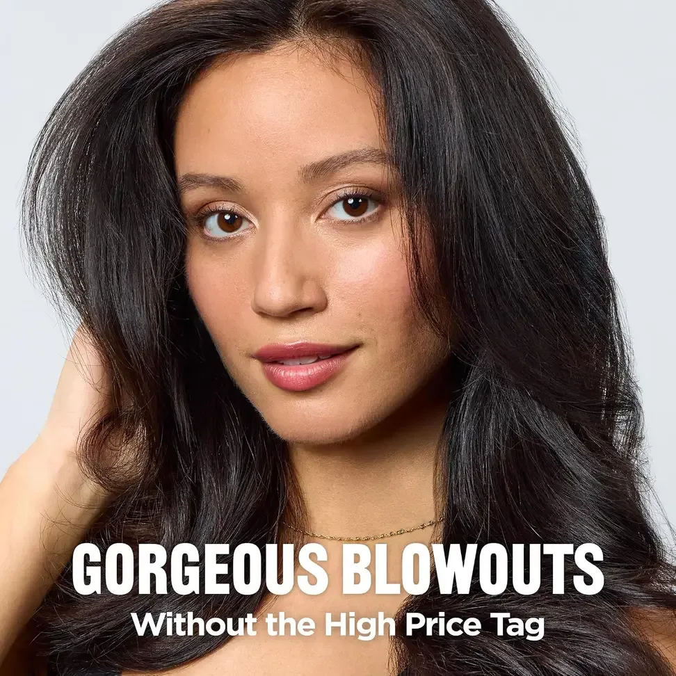 Glossy, voluminous blowout styled with the hair dryer brush