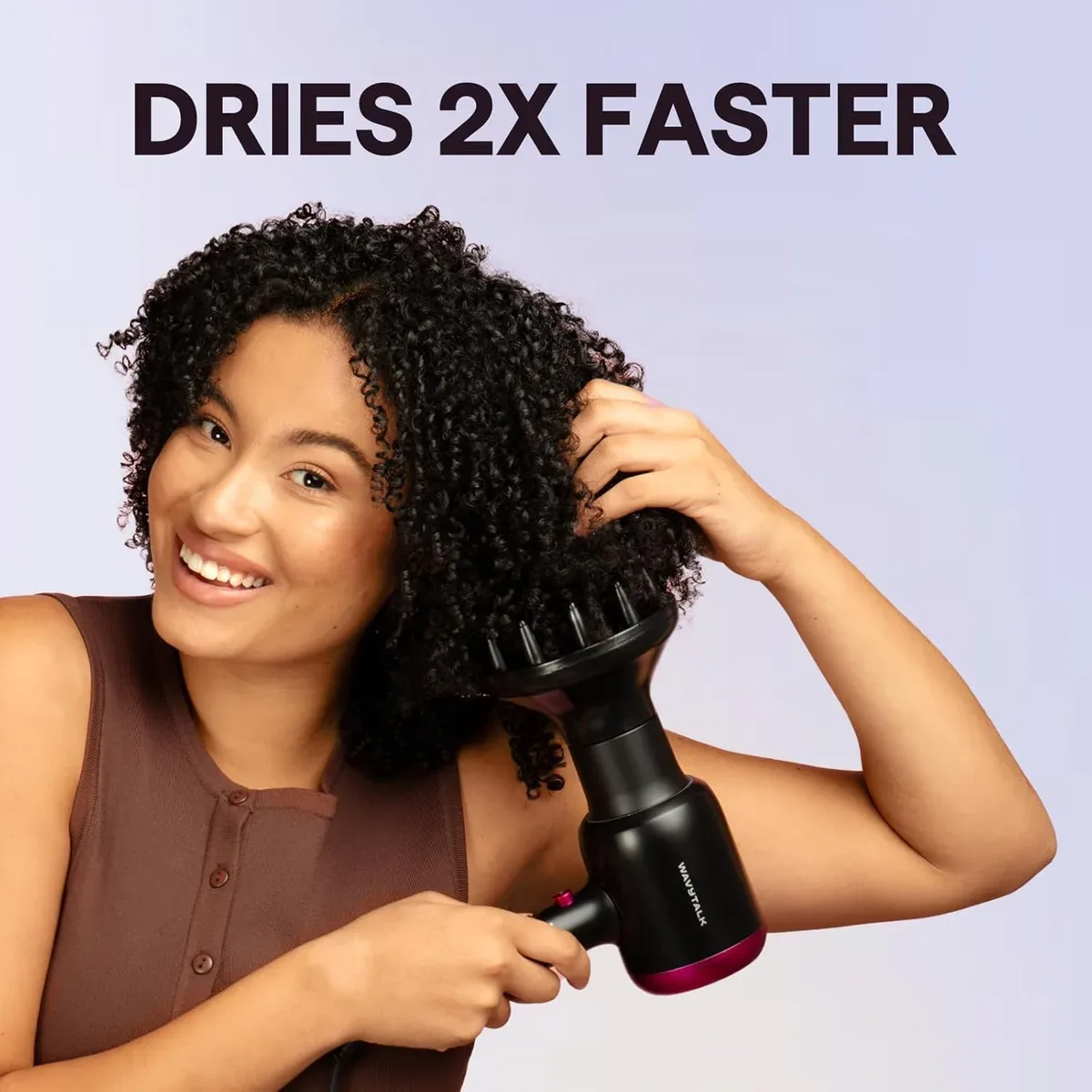 Woman drying natural curls using the ionic hair dryer with diffuser
