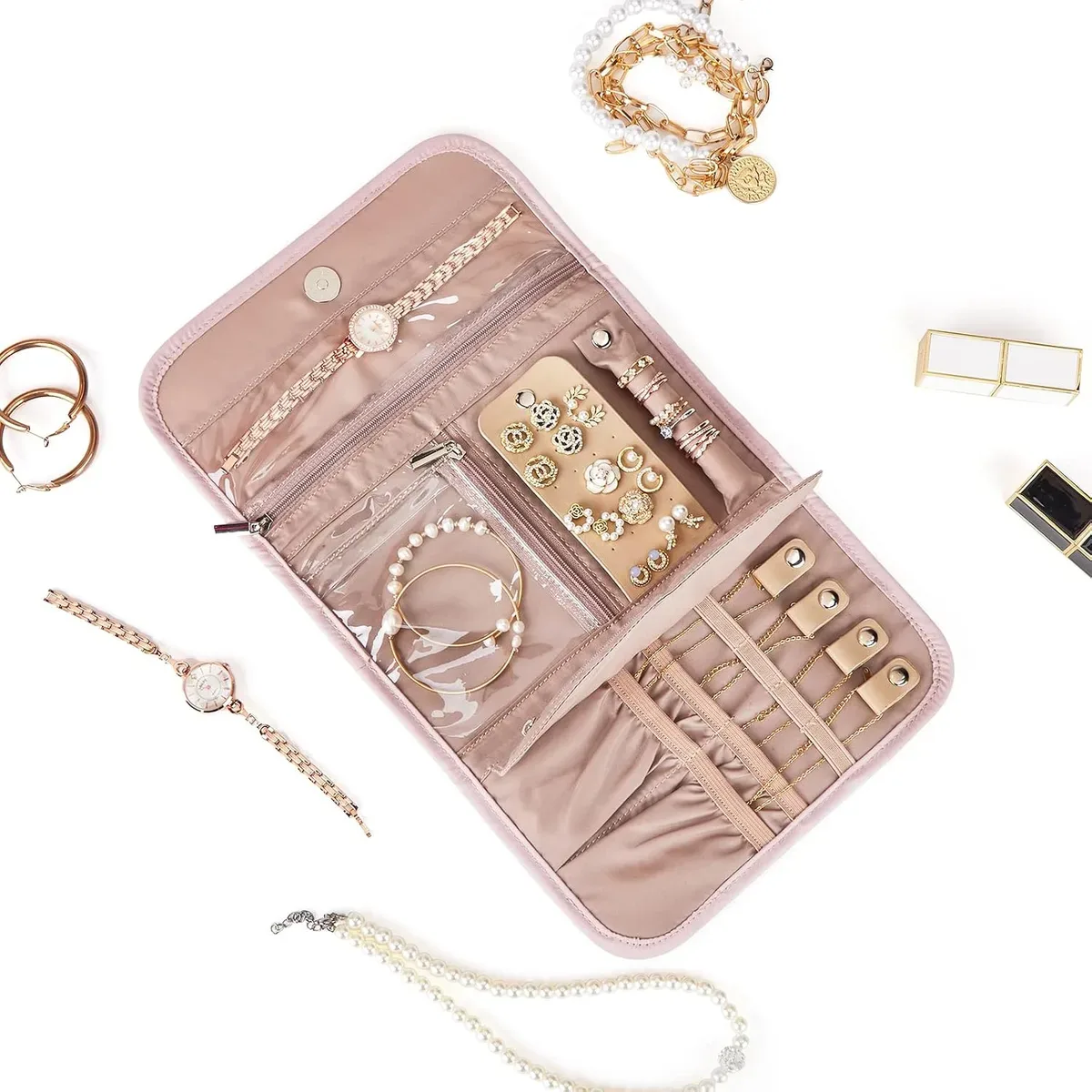Open jewelry roll organizer filled with necklaces and bracelets