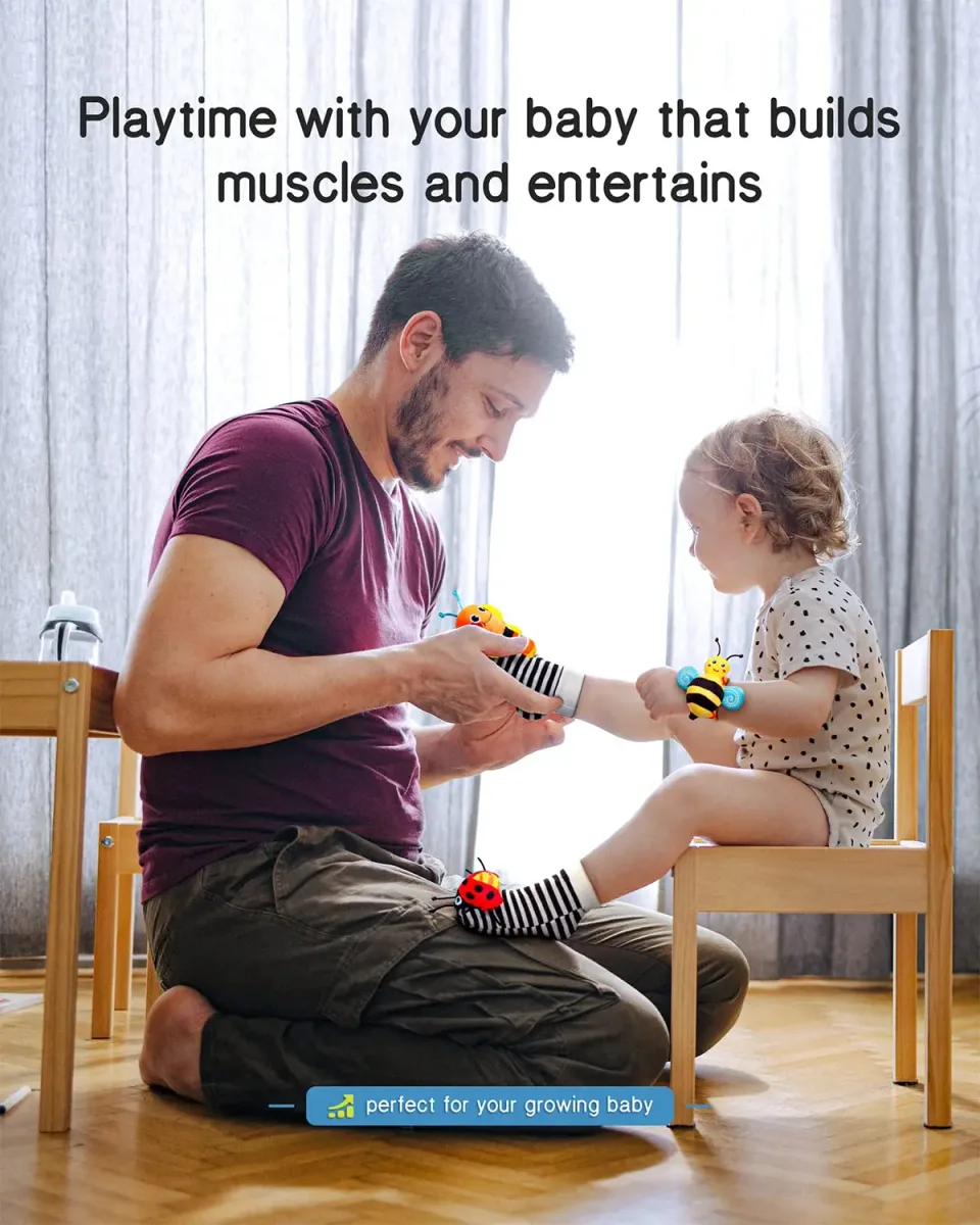 Parent playing with a baby wearing baby wrist rattles