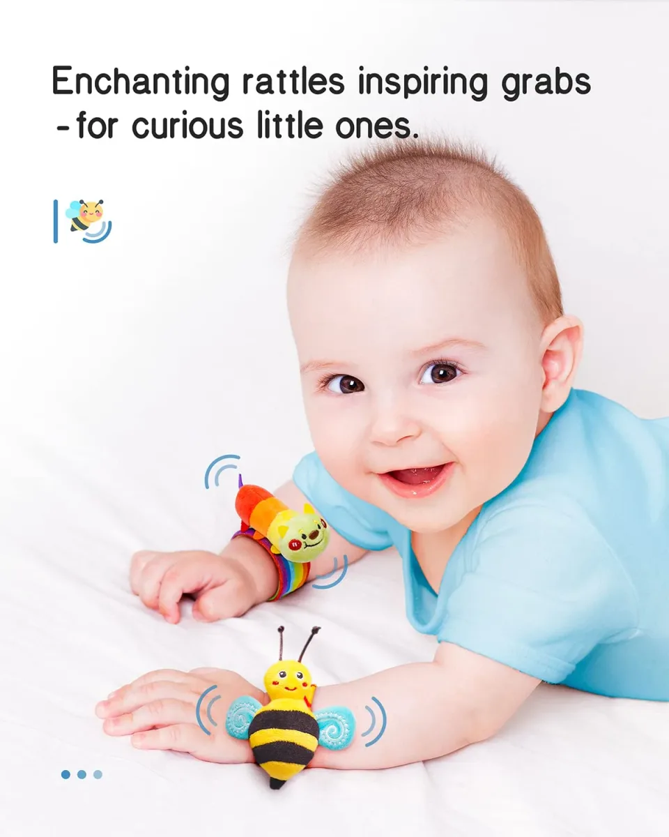 Baby reaching for one of the baby wrist rattles