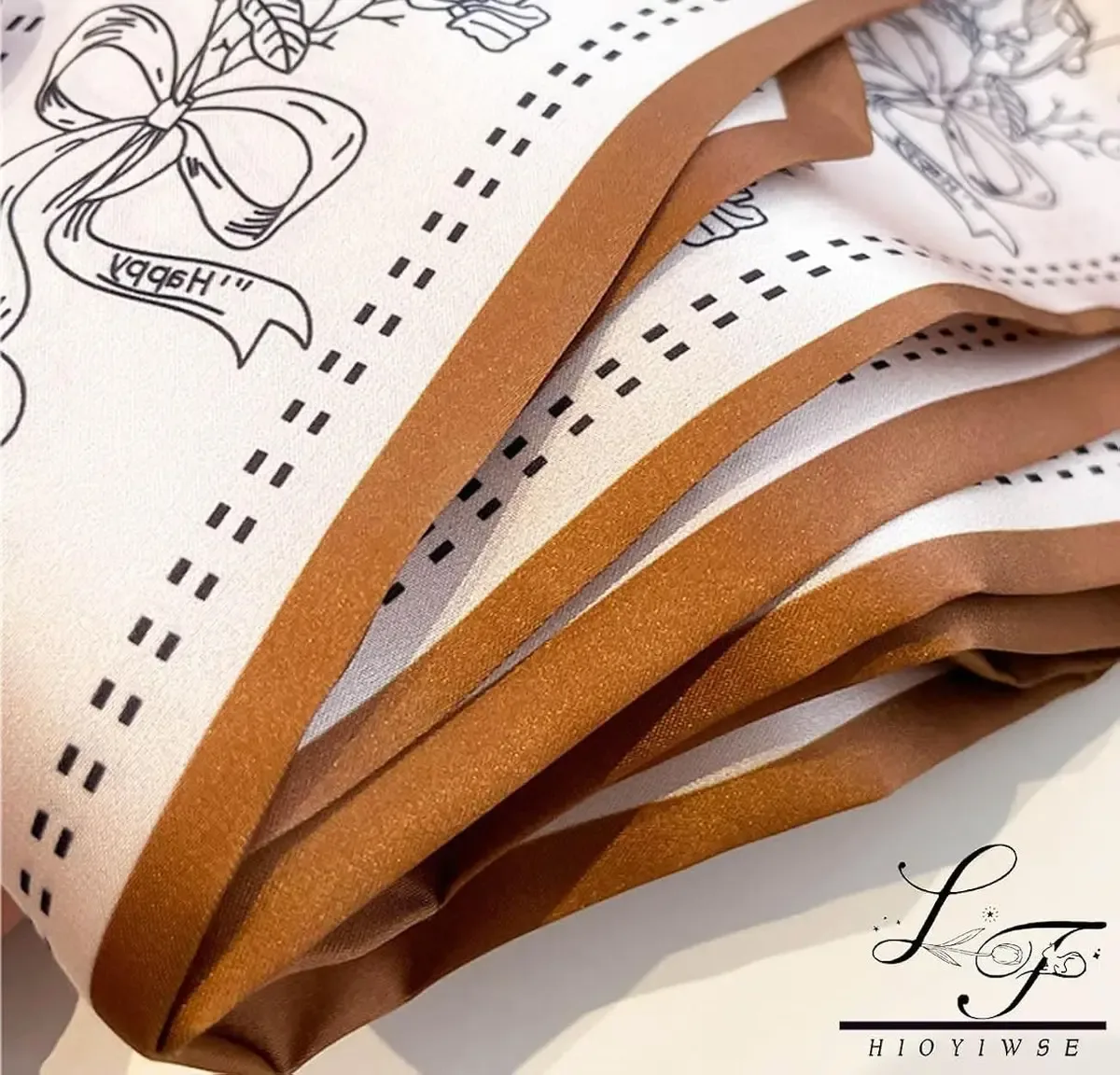 Close-up of the printed pattern on the skinny satin scarf