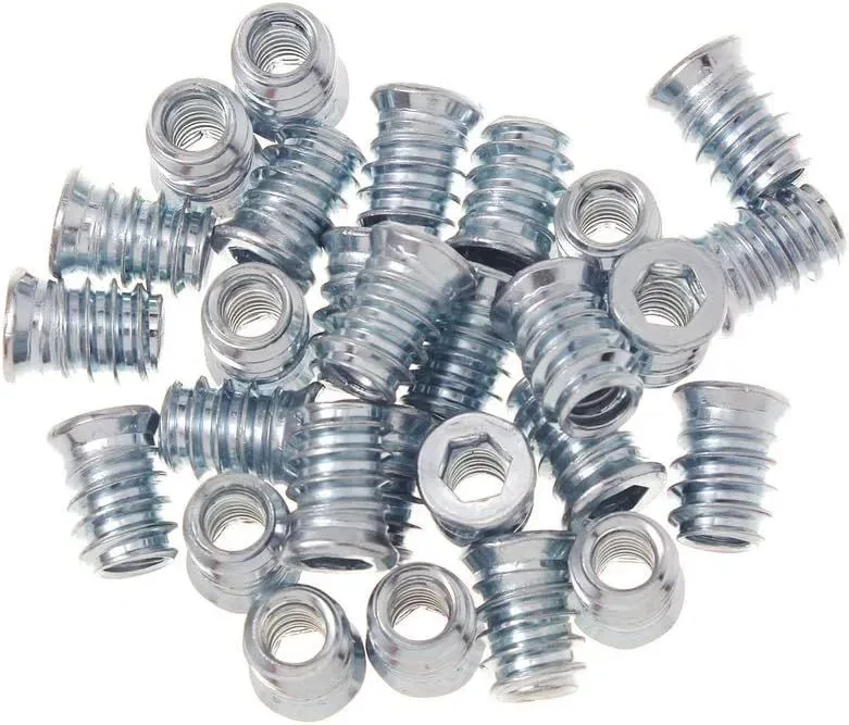 Hex drive heads on threaded inserts for wood, close up