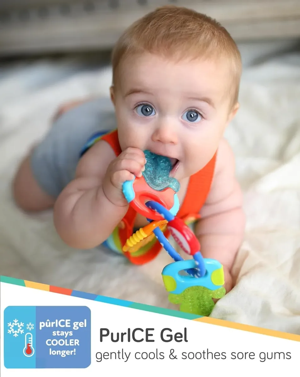 Cooling teether keys pressed against sore gums for relief