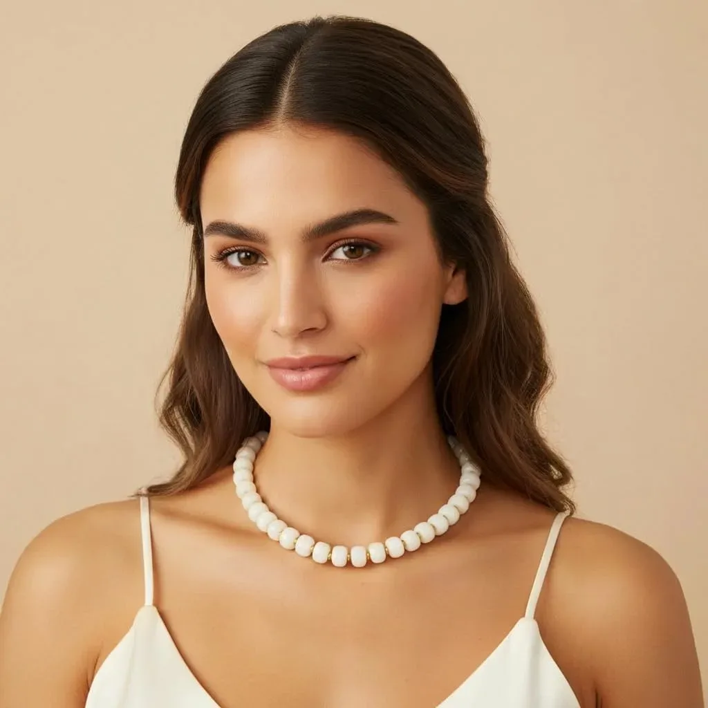 Chunky beaded necklace resting at the collarbone
