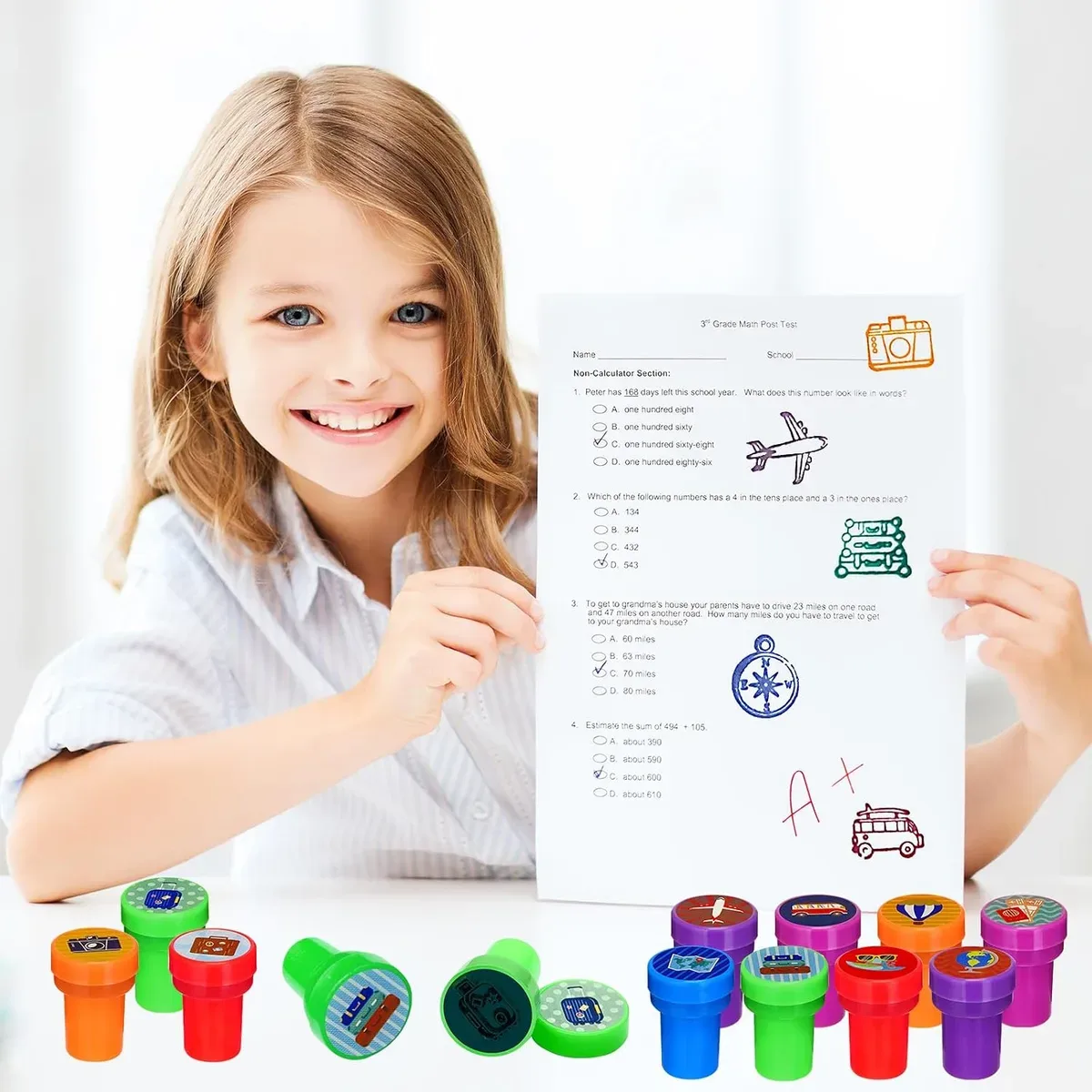 Girl decorating a card with self-inking stampers for kids